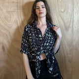 Woman wearing the All Religions shirt by Leon Dream