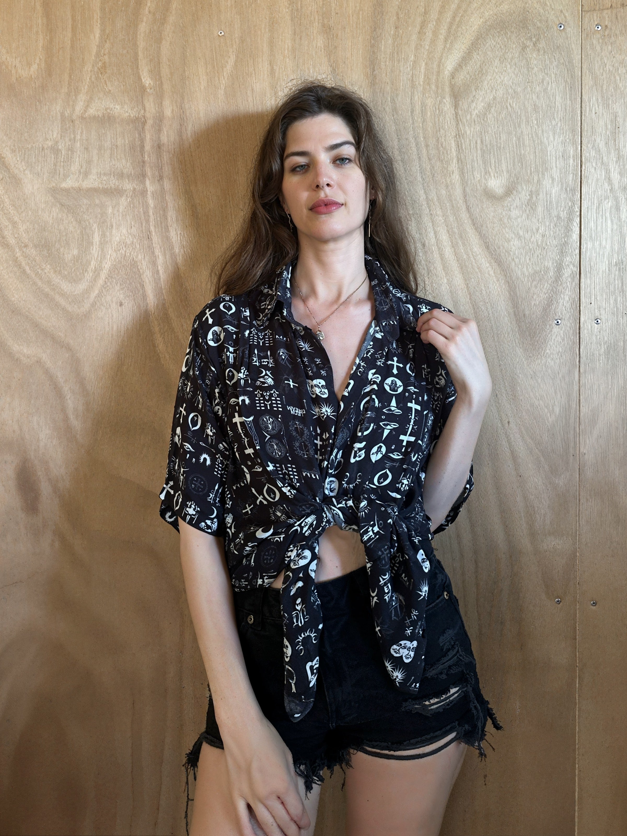 Woman wearing the All Religions shirt by Leon Dream