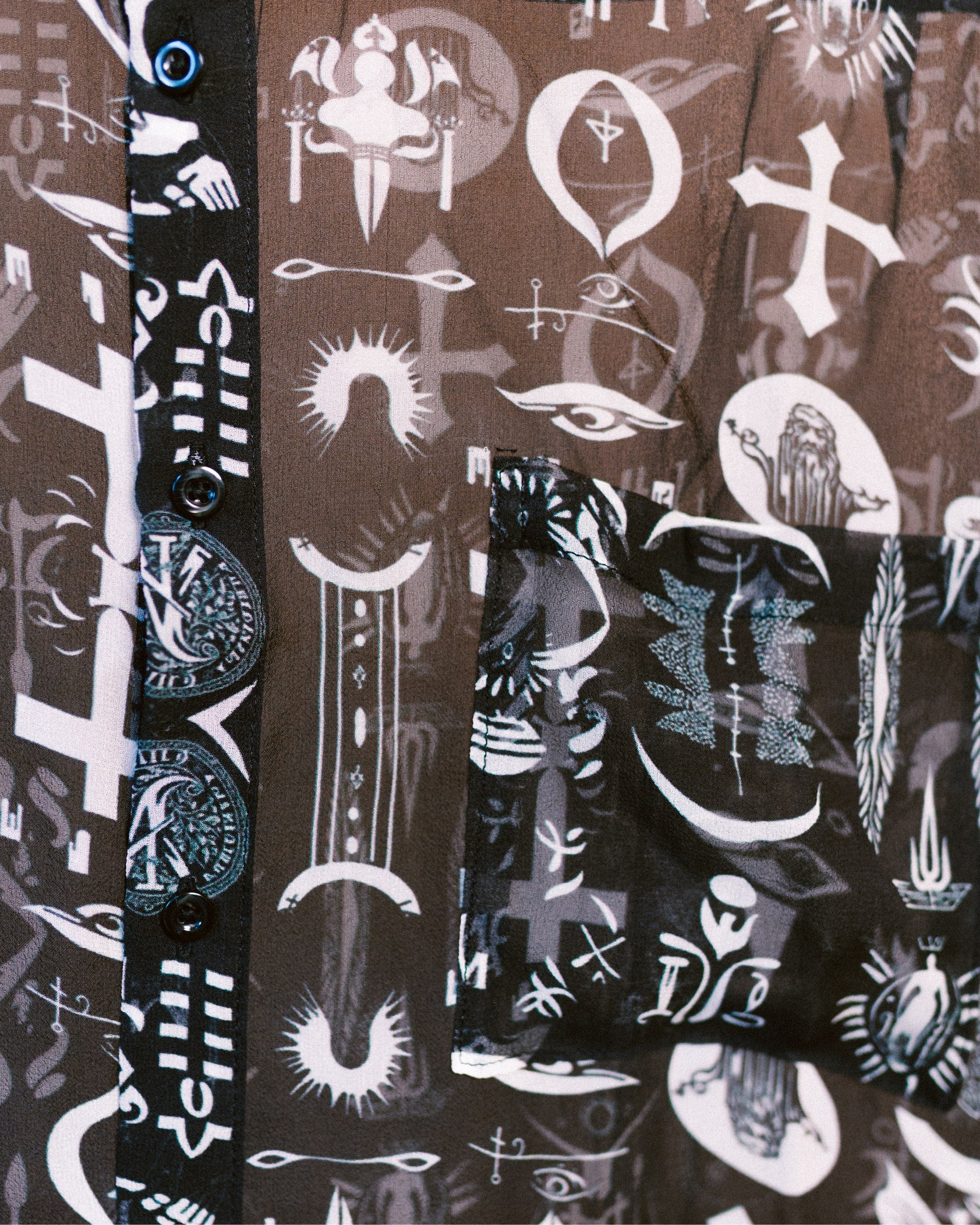 Close-up details of the All Religions shirt by Leon Dream