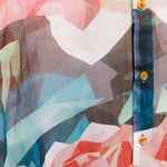 Close-up shot of the patterns of the Geometric Roses silk chiffon shirt by Leon Dream