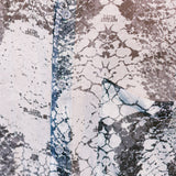 Close-up shot of the patterns of the Green Ophidian silk chiffon shirt by Leon Dream