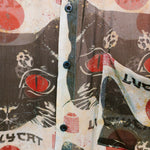 Close-up shot of the patterns on the Lucky Cat shirt by Leon Dream