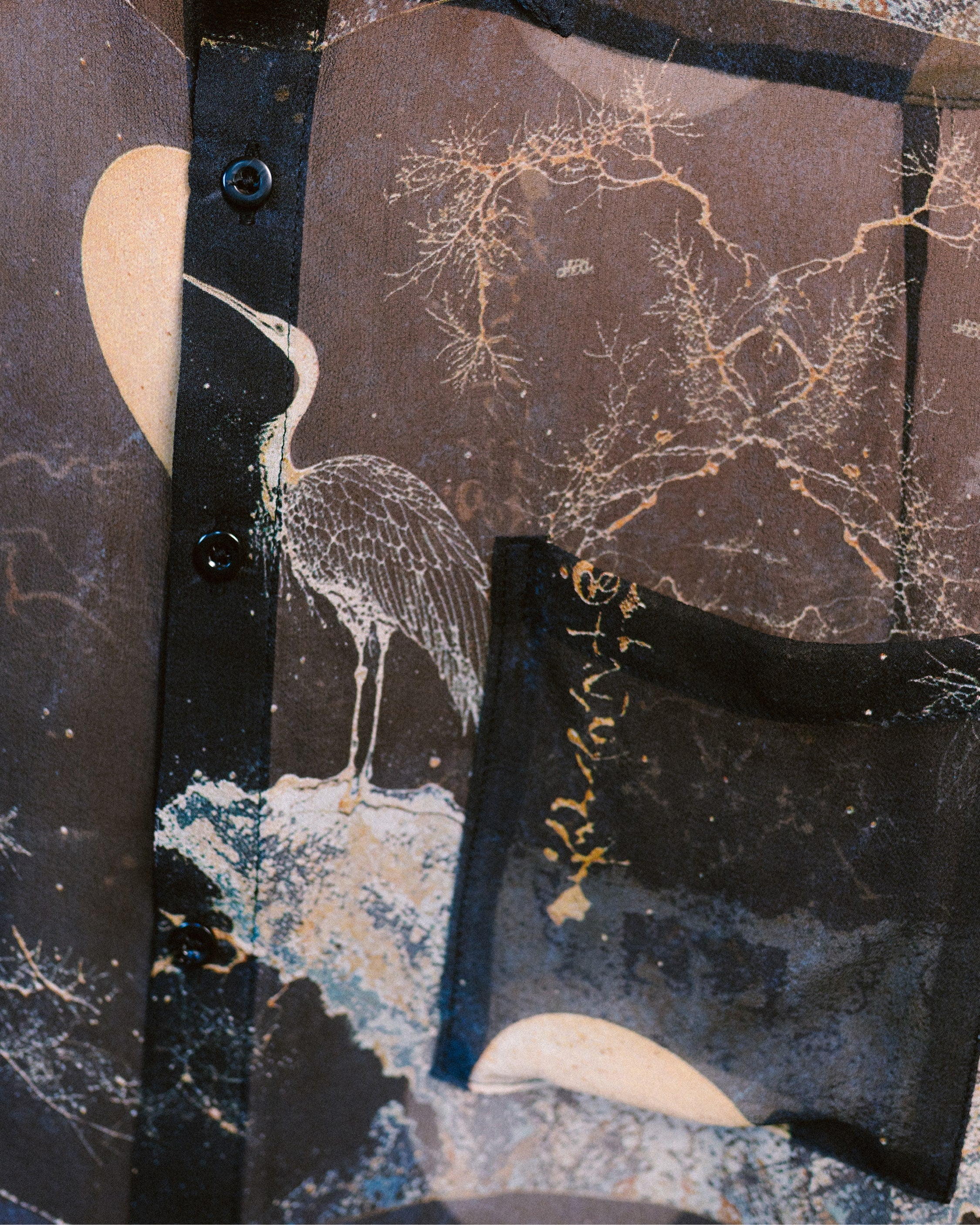 Detailed shot of the Moon Hunter Patterns on a silk chiffon shirt by Leon Dream