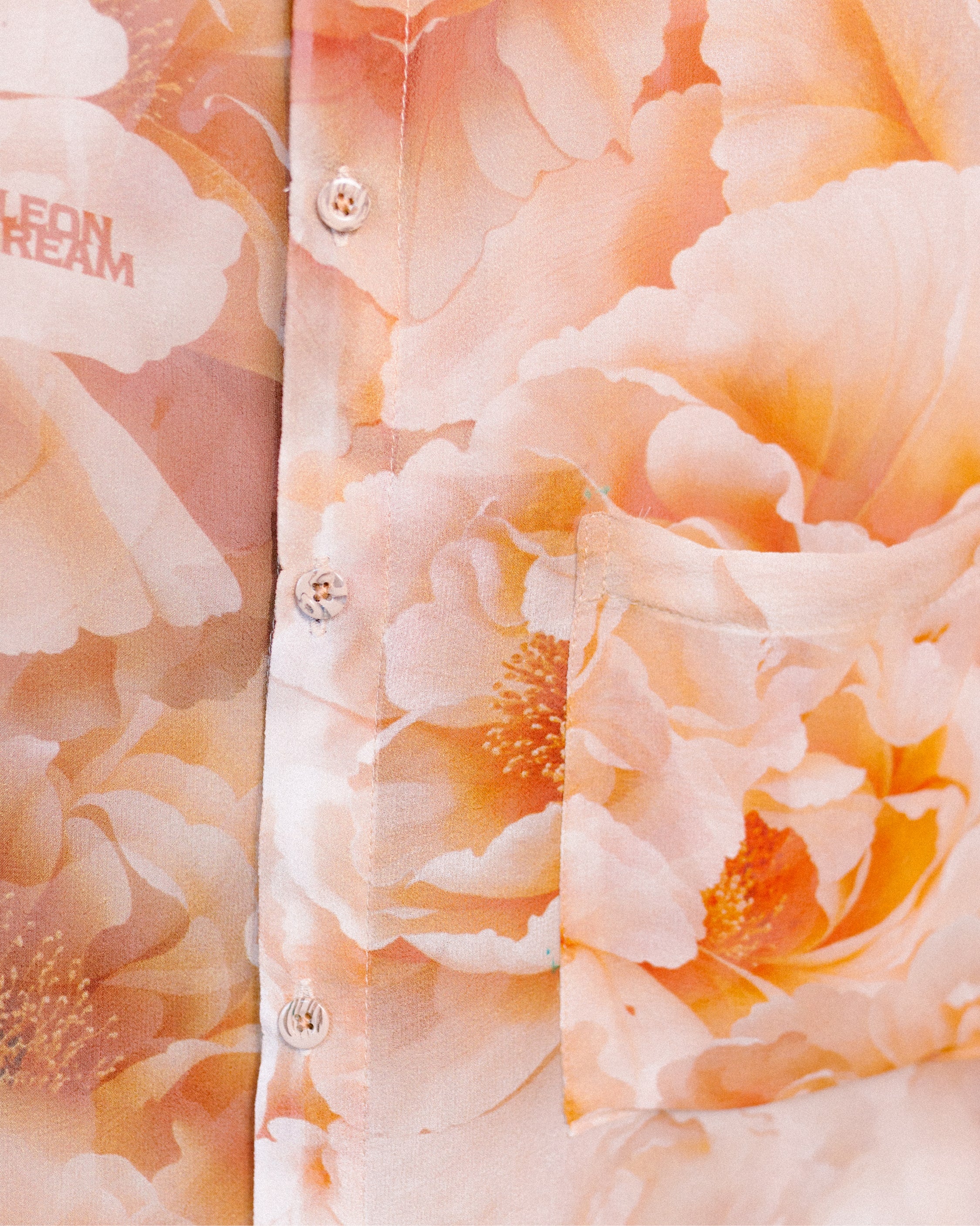 Close-up shot of the Plush Petals pattern on a shirt by Leon Dream